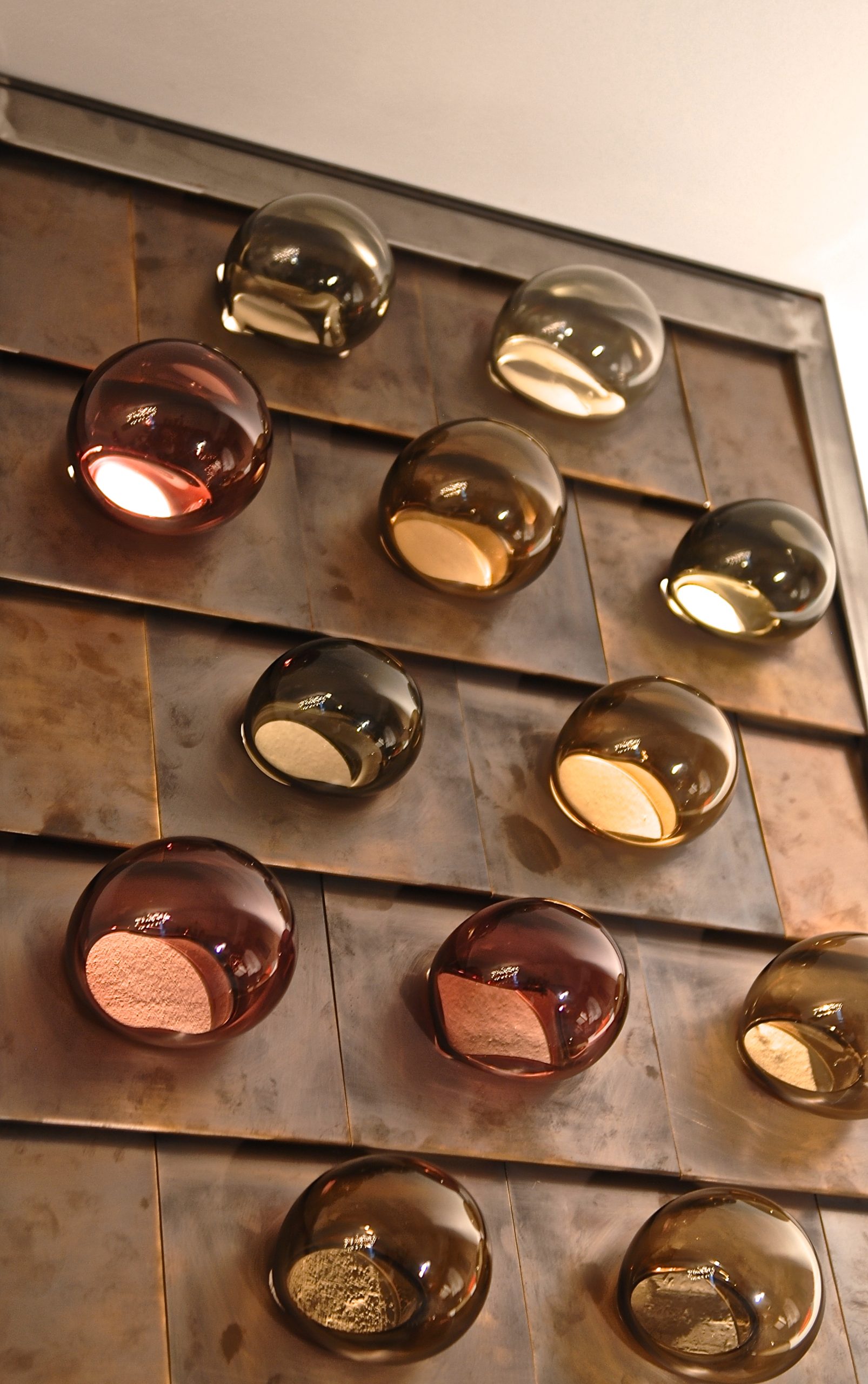 Blown Murano glass bubbles in brown shades.